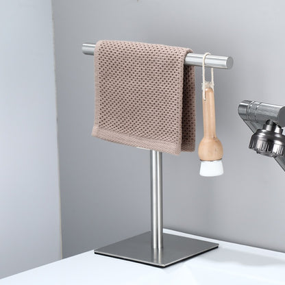 Havlin towel holder in brushed steel beside a basin with a hand towel