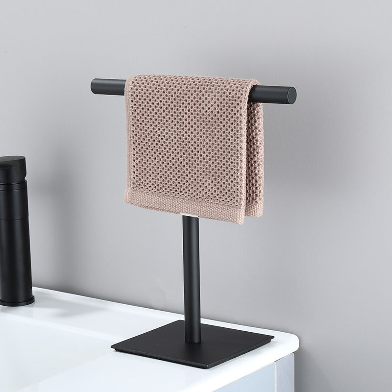 Havlin towel holder in matte black beside a basin with a hand towel