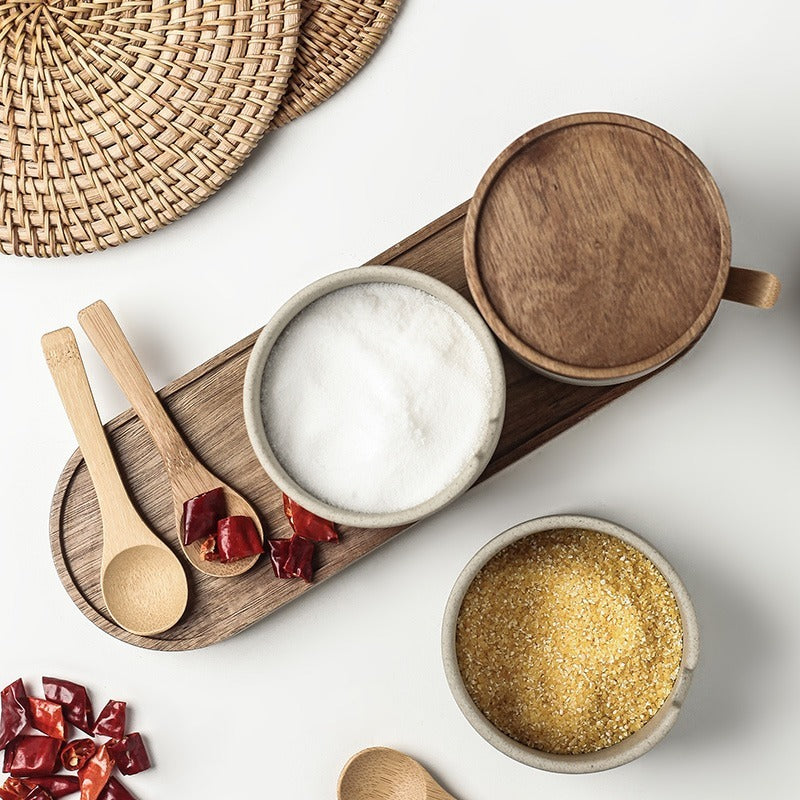 Sazuna jars holding salt and dried chilli with the spoons alongside