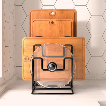 Kantora black cutting board and pot lid rack holding a glass lid and boards