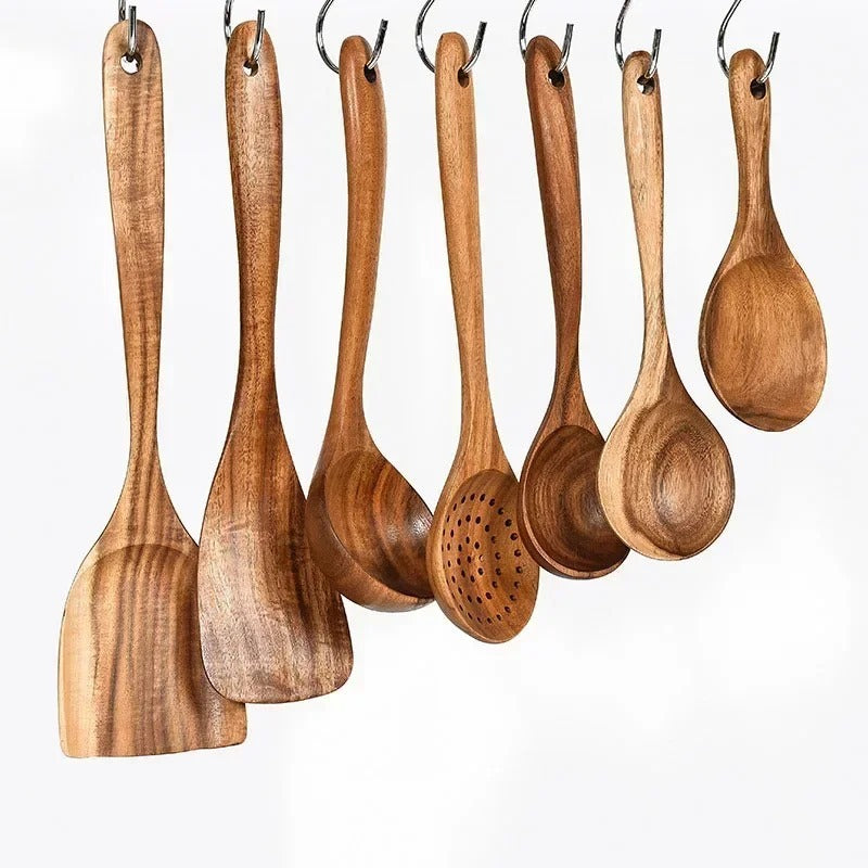 Teakoro utensils hanging from a rail by their hanging holes