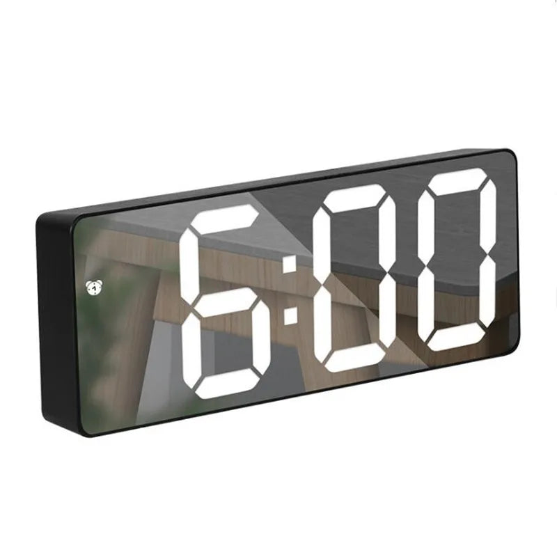 Reflexa mirror alarm clock showing the time on its mirrored face
