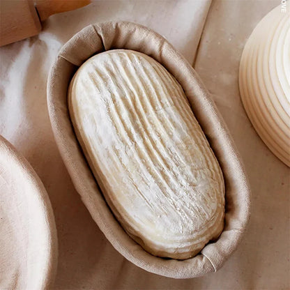 Sourdough dough proofing in the oval rattan banneton basket