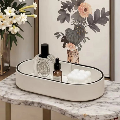 Valera valet tray on a marble console with perfume and candles