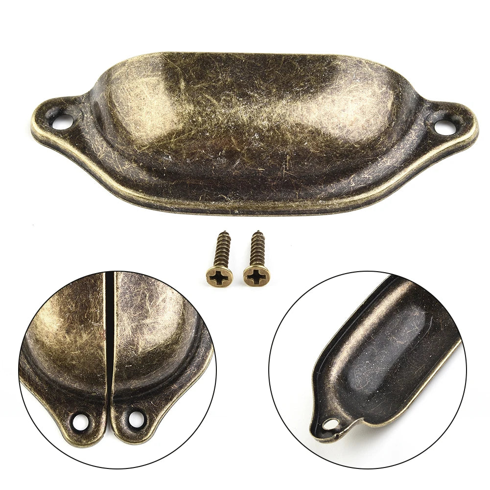 Single antique cup pull handle with screws and close-up detail