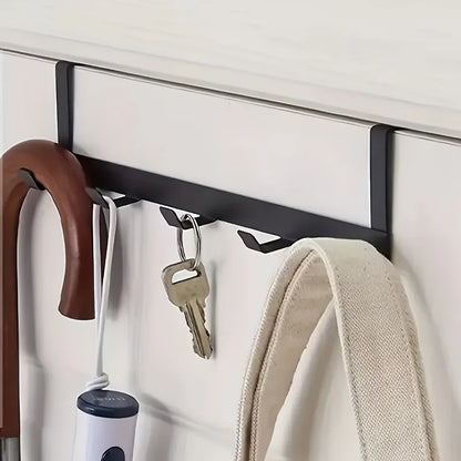 Close-up of an umbrella, keys and a bag on the Doorvia hooks