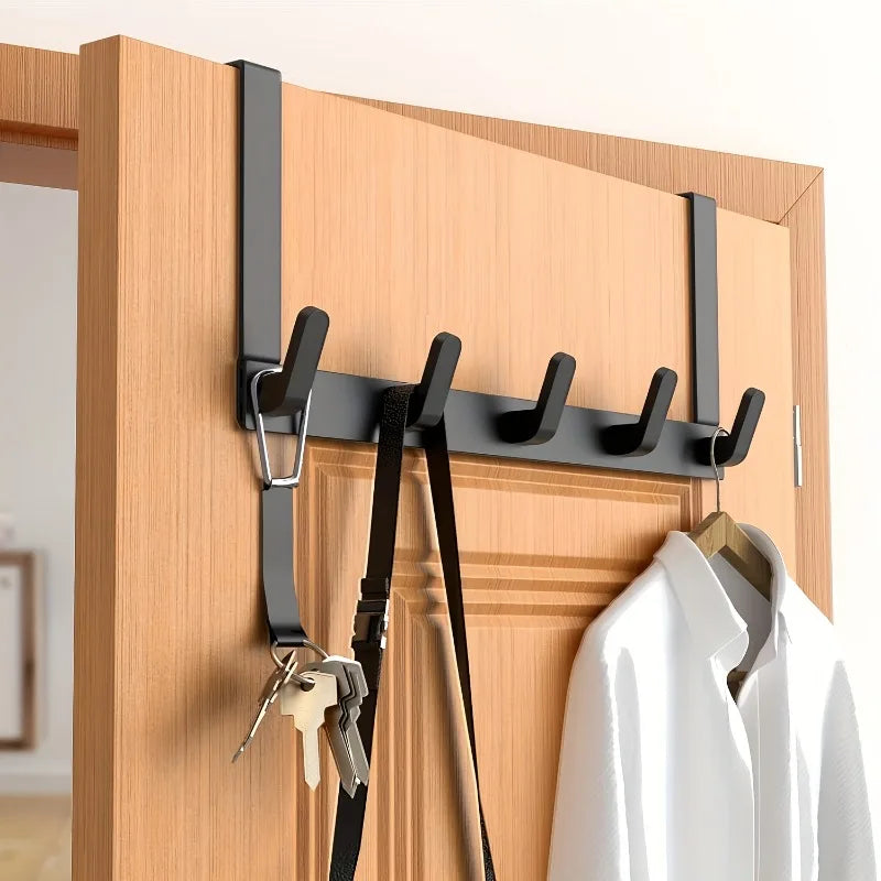 Doorvia black hook rack on a wooden door with coats and keys