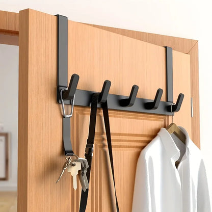 Doorvia black hook rack on a wooden door with coats and keys