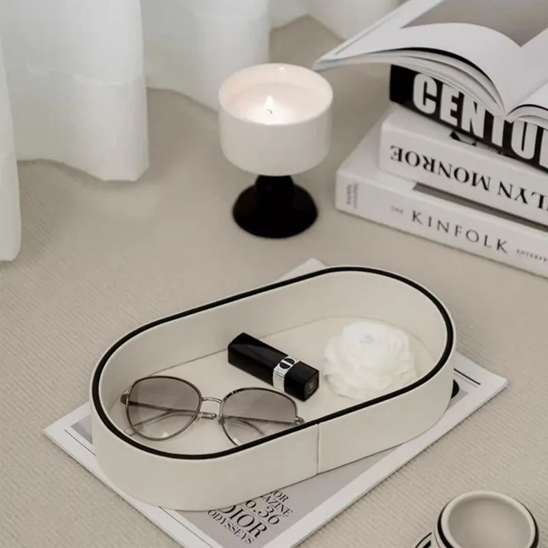 Glasses and lipstick in the Valera tray beside a candle