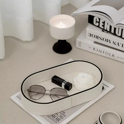 Glasses and lipstick in the Valera tray beside a candle