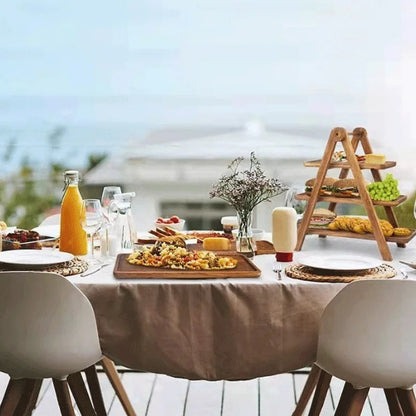 Acacia tiered serving stand styled on an outdoor table