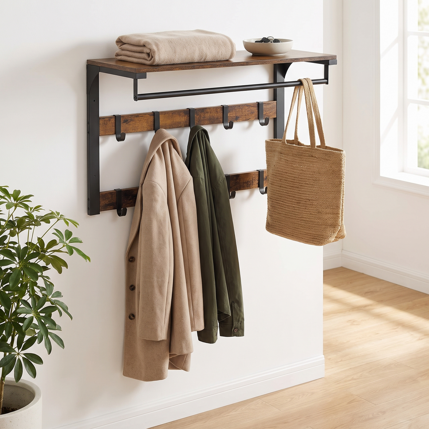 Arvid coat rack in a Scandinavian entryway with coats, tote bag and blanket