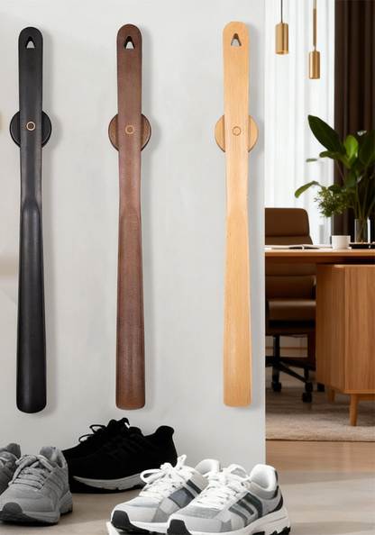 Lyfta magnetic beech wood shoe horns in black, coffee brown and natural beech mounted on an entryway wall