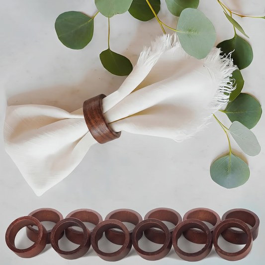 Servera wooden napkin rings - linen napkin gathered through a ring, flat lay