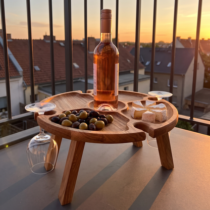 Vinetta folding wooden wine table - on a balcony at sunset