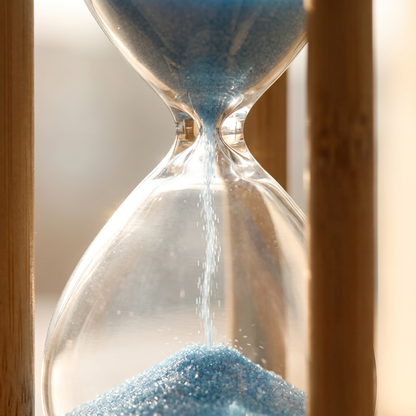 Zandra bamboo sand timer - macro of the sand running through the glass waist